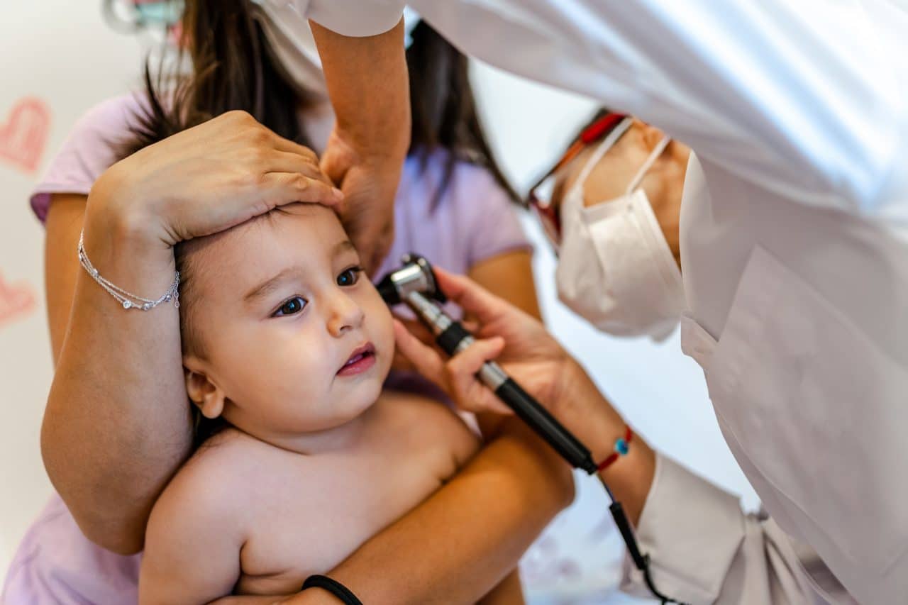 Close up of a pediatrician having a check up on her baby patient