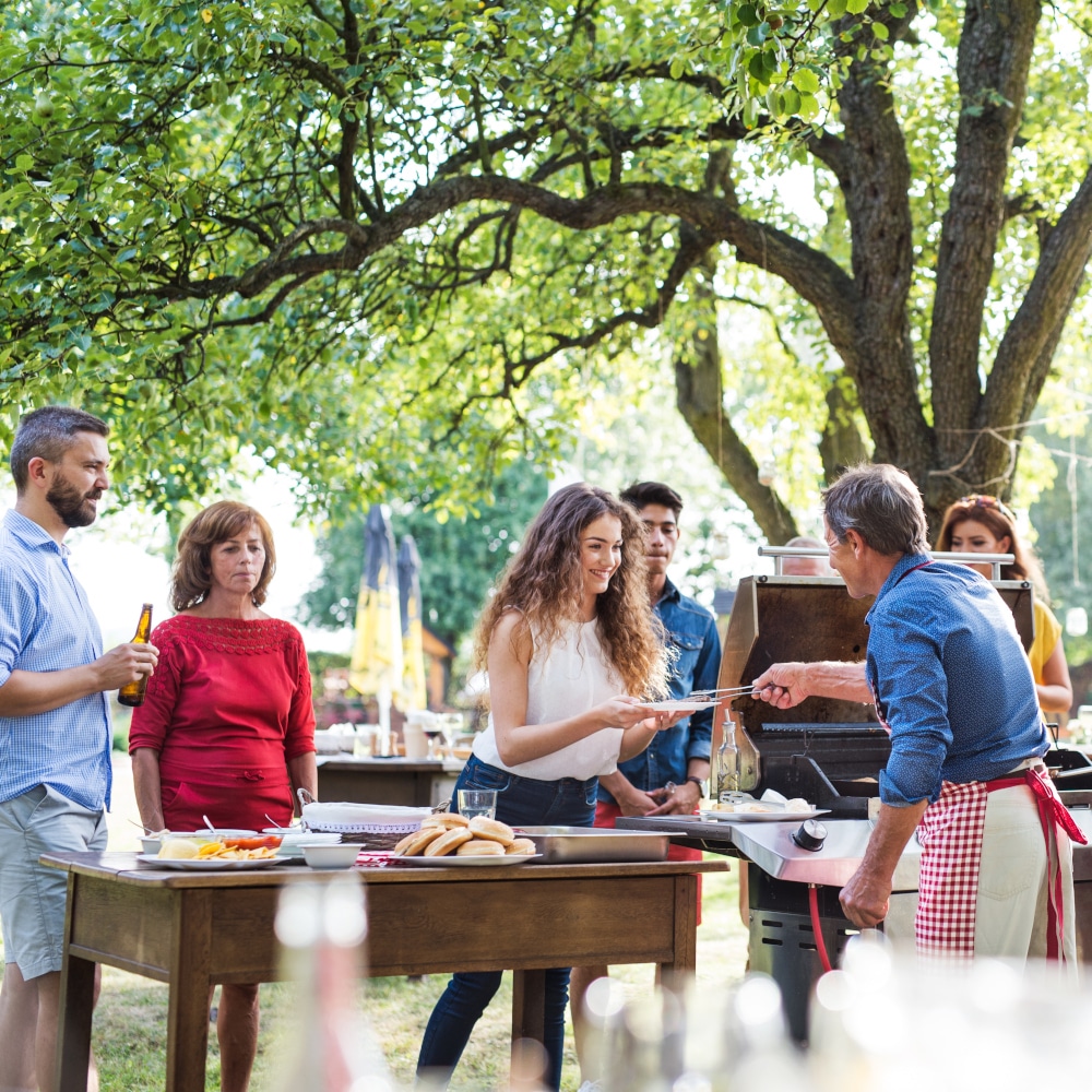 A family gathers for a barbecue party