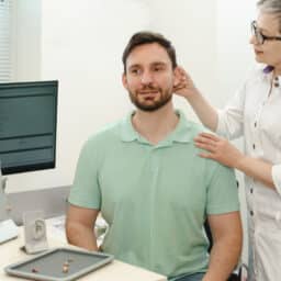 Man at a hearing aid fitting