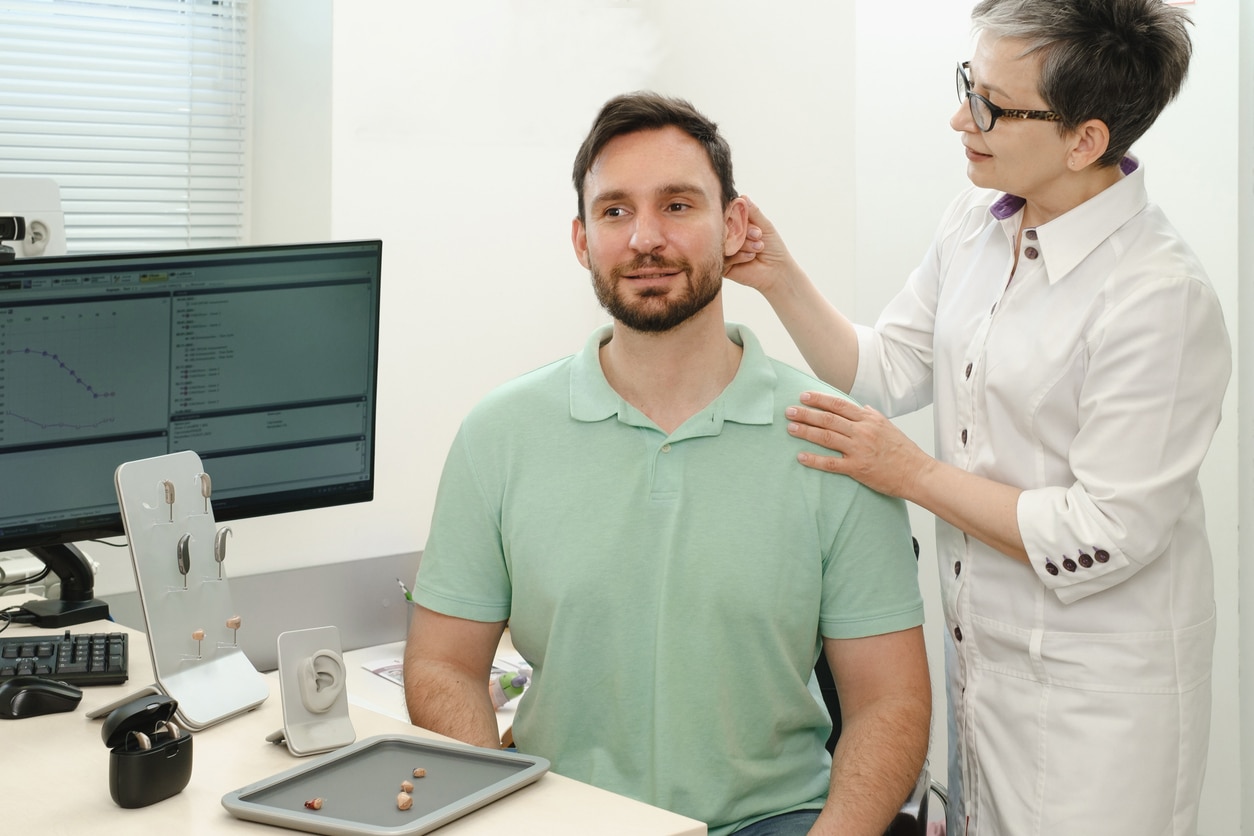 Man at a hearing aid fitting