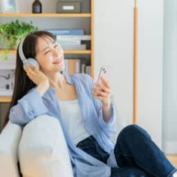 Happy woman listening to an audiobook